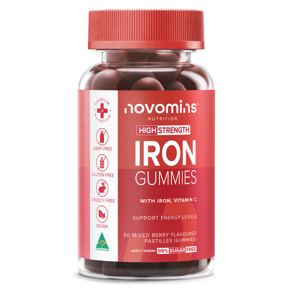 A bottle of Novomins Nutrition High Strength Iron Gummies, featuring a red cap and a red label with white text and icons, containing dark red gummy tablets.
