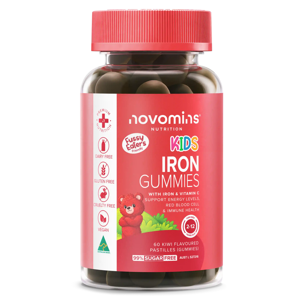 A bottle of Novomins Nutrition Kids Iron Gummies, featuring a red cap and a red label with a cartoon teddy bear, set against a plain white background.