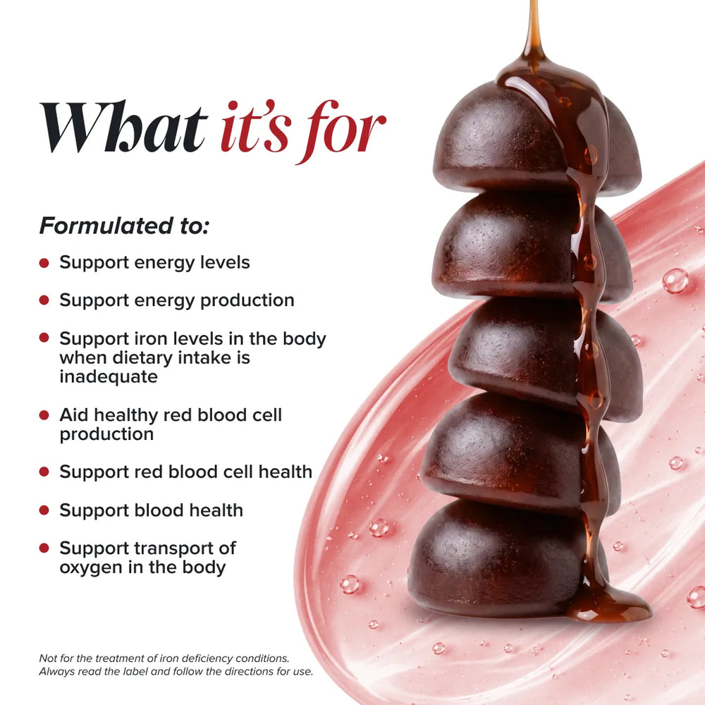 Promotional graphic for a dietary supplement, featuring a stack of dark brown capsules dripping with a glossy brown substance on a pink wave background, with text detailing the product's benefits for energy, iron, and blood health.