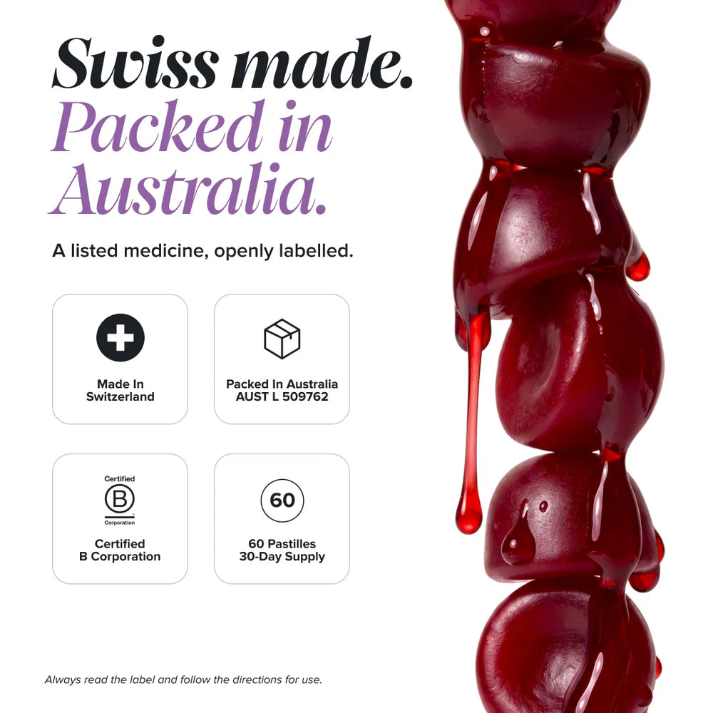 Promotional graphic for a Swiss-made medicine product, featuring a vertical stack of glossy dark red pastilles on the right side and text on the left reading 'Swiss made. Packed in Australia.