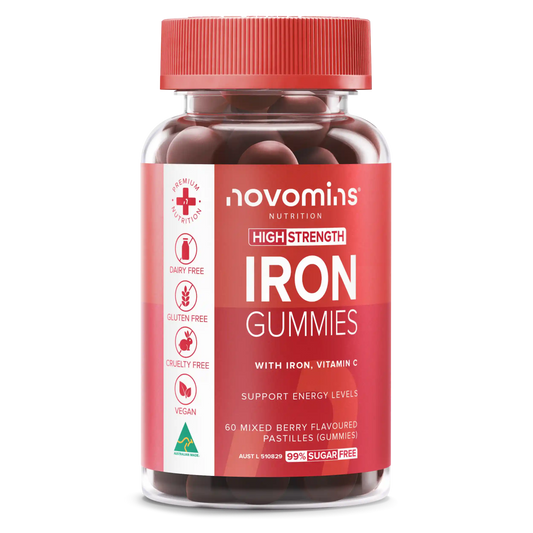 A bottle of Novomins Nutrition High Strength Iron Gummies, featuring a red cap and a red label with white text and icons, containing dark red gummy tablets.