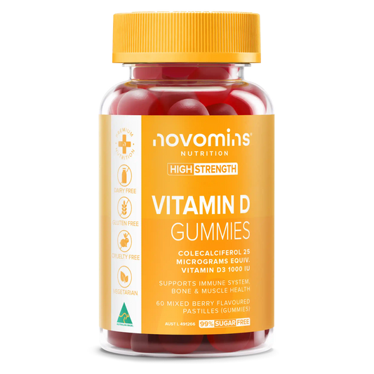 A bottle of novomins Nutrition Vitamin D Gummies with a bright yellow cap and a yellow-orange label, containing red gummy capsules, shown on a plain white background.