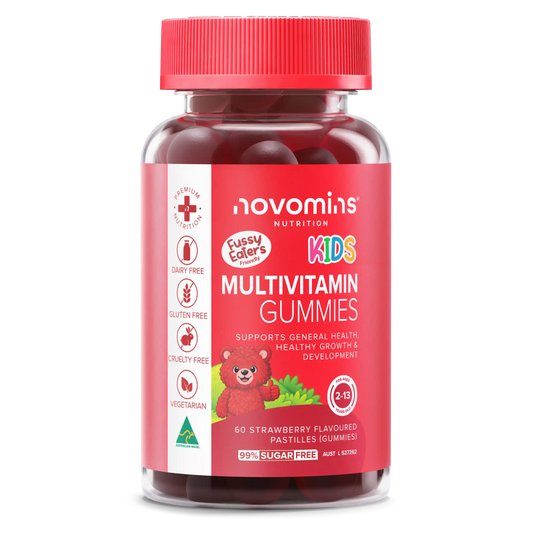 A bottle of Novomins Nutrition Fussy Eaters Kids Multivitamin Gummies, featuring a red cap and a red label with a cartoon teddy bear, set against a plain white background.

