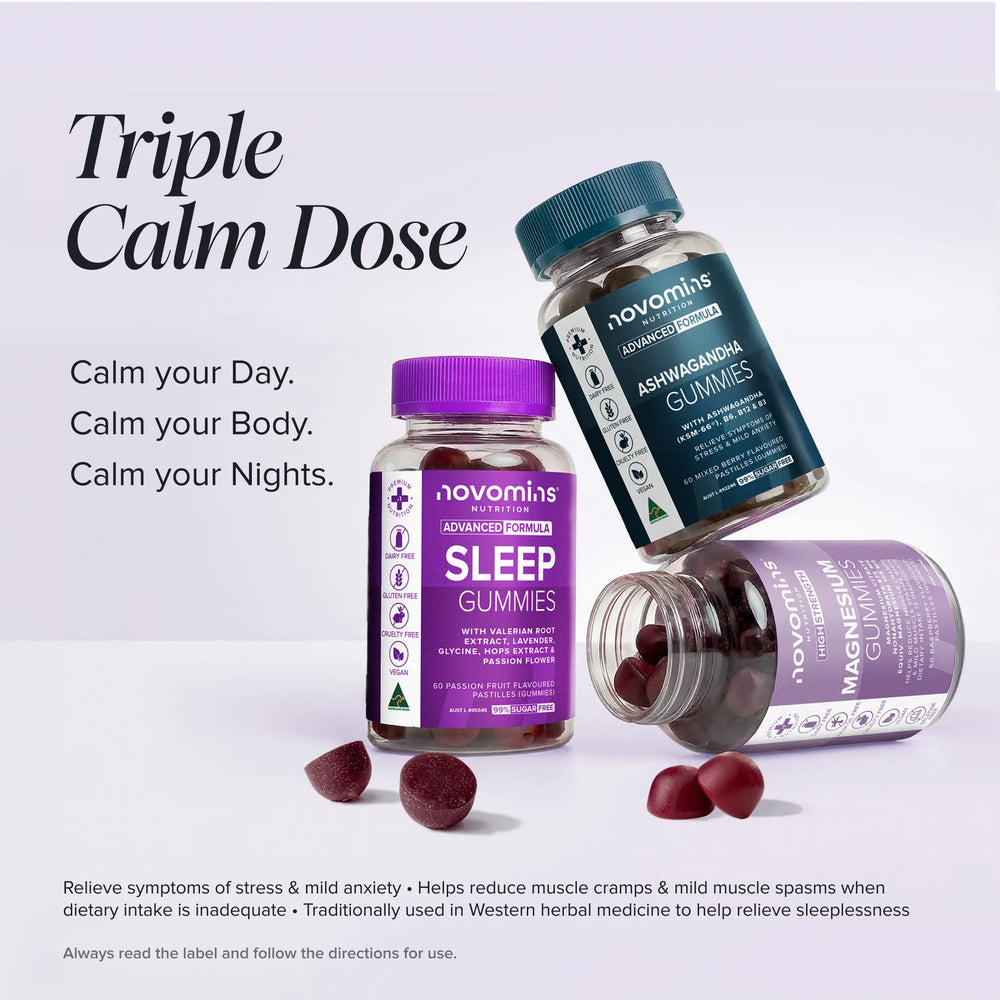 Three bottles of novomins Triple Calm Dose herbal sleep gummies arranged on a light gray studio background, with one bottle lying on its side and several dark red gummies scattered in front. Large text reads 'Triple Calm Dose' and smaller text lists benefits.