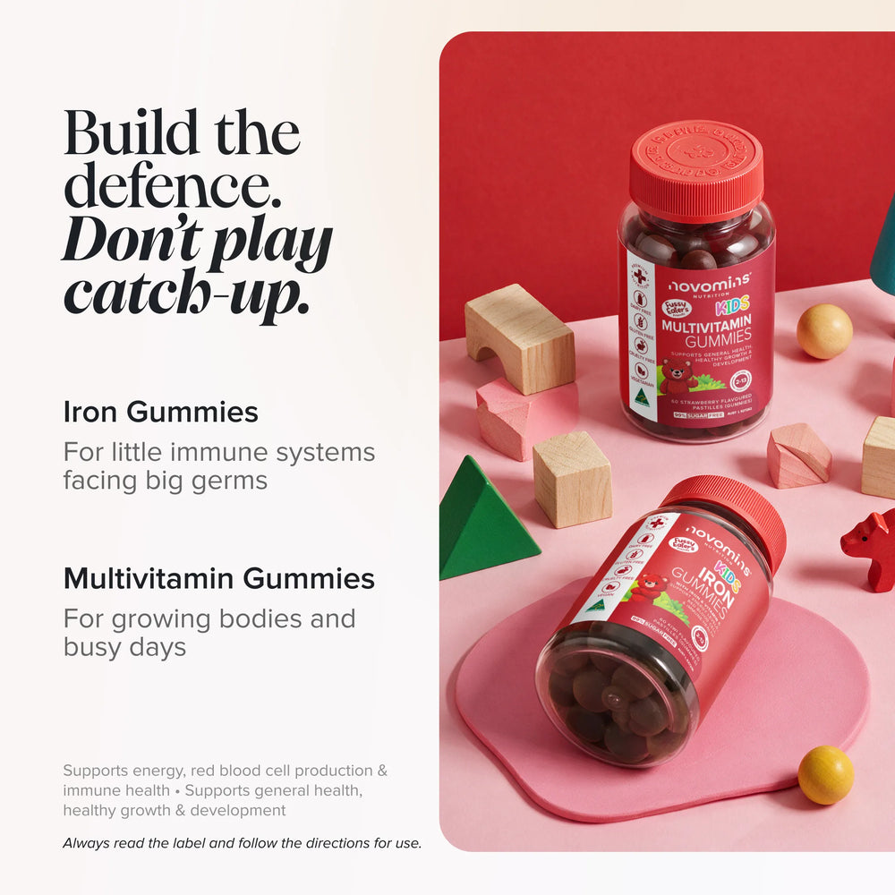 Kids Multivitamin and Kids Iron Gummies bottles among wooden toy blocks on a pink background, headed 'Build the defence. Don't play catch-up.'