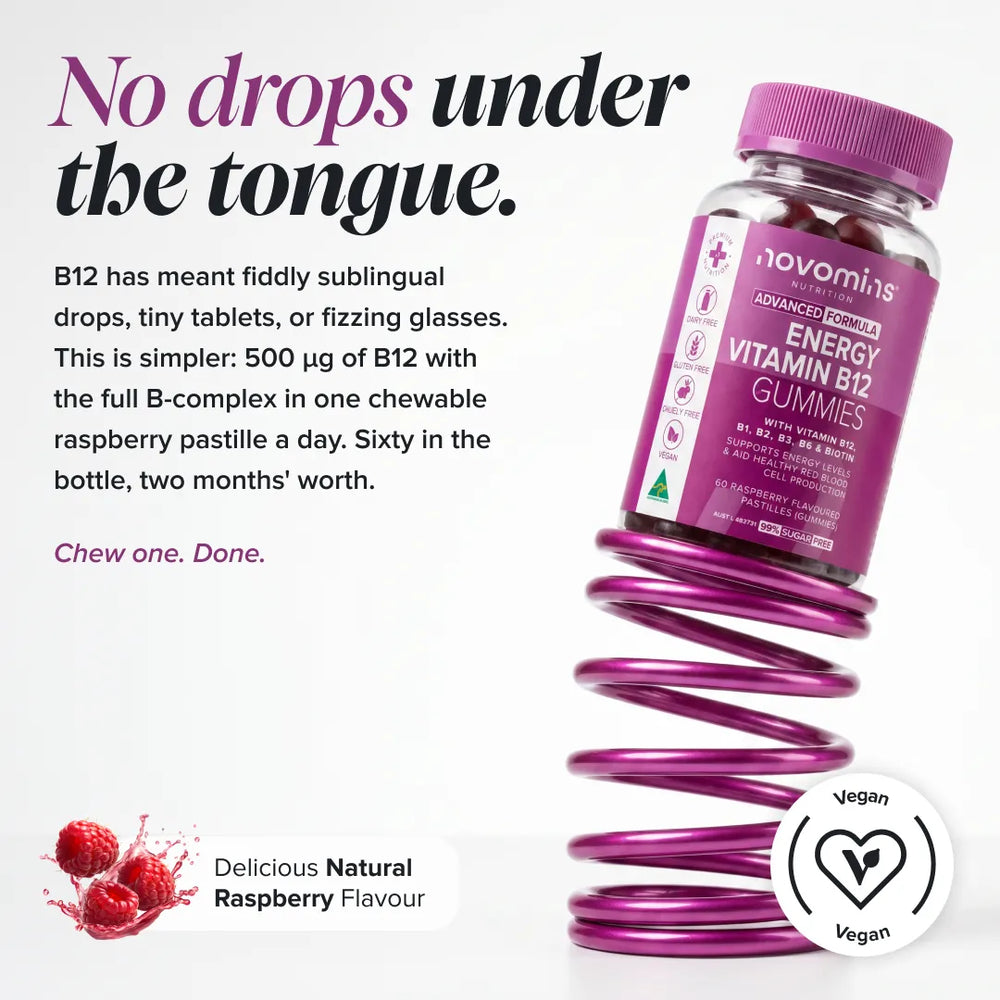 A bottle of novomins Energy Vitamin B12 Gummies in raspberry flavor, shown on a white background with marketing text, a raspberry splash graphic, and a vegan badge. The bottle is positioned over a metallic purple coil spring.